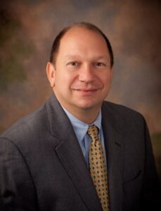 Professional photo of Edward Banos, CEO of University Health and THOT member at large
